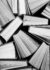 A black and white image of hardback books or text books from abo